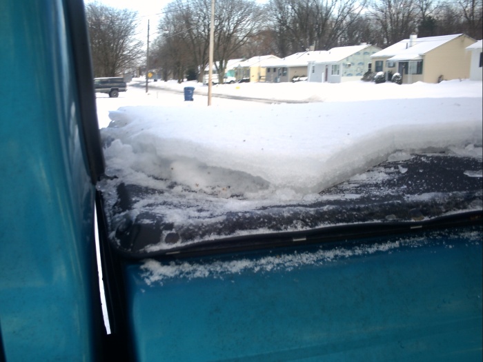 Ice on truck bed cover.JPG